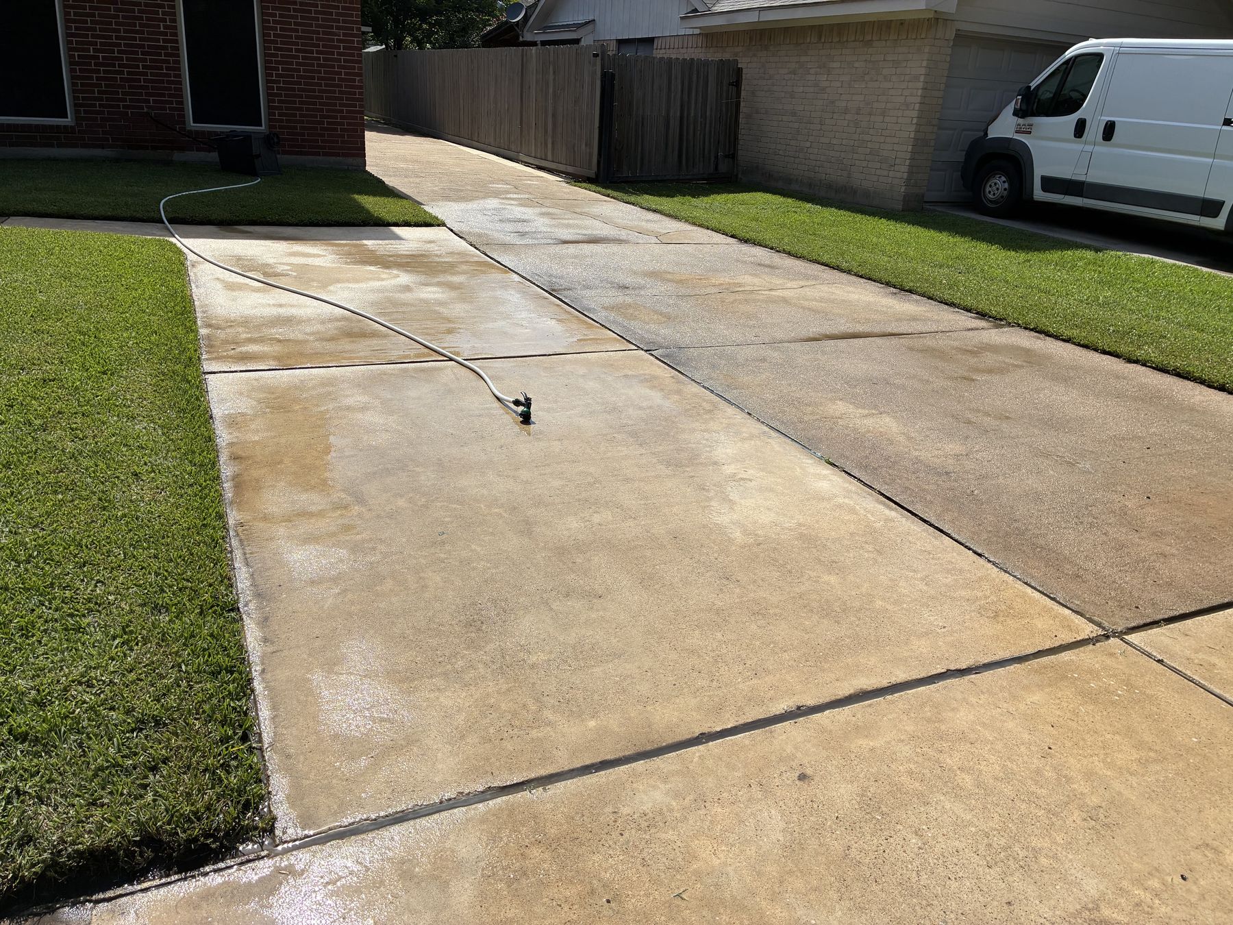 Driveway after pressure washing — clean, even concrete